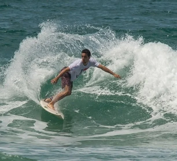 Raphael carving a turn on a wave