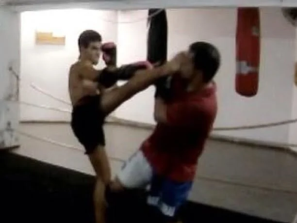 Raphael landing a kick on a sparring partner in the ring
